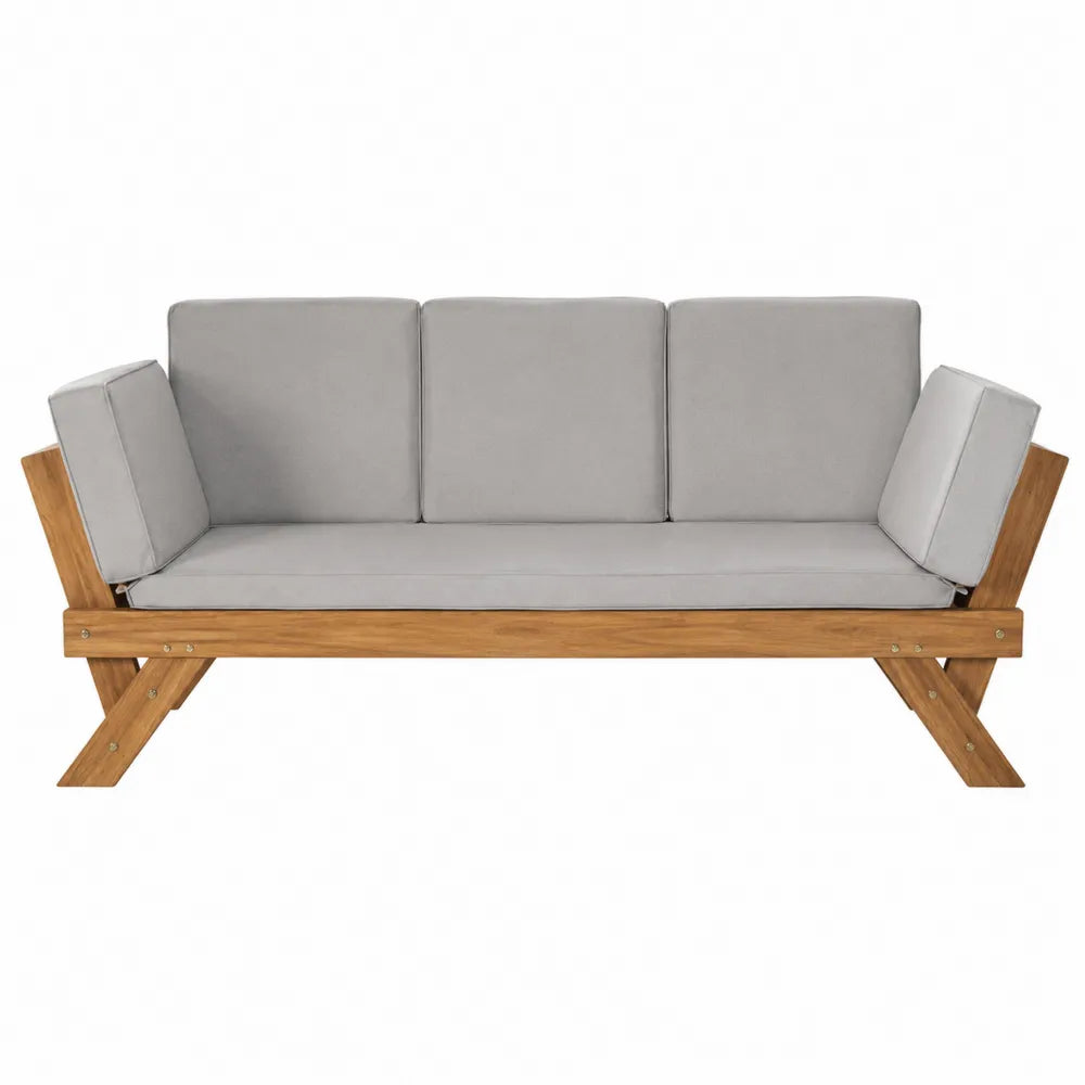 Sofa ogrodowa z drewna akacji z szarymi poduszkami